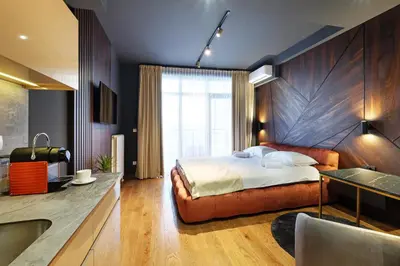 a bedroom with a bed and a bathroom with a tub at Belgrade Waterfront Apartments - Arcadia in Belgrade