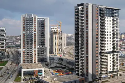 a group of tall buildings in a city at Belgrade Waterfront Apartments - Arcadia in Belgrade