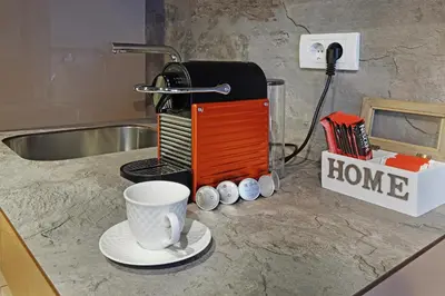 a coffee maker and a cup on a counter at Belgrade Waterfront Apartments - Arcadia in Belgrade