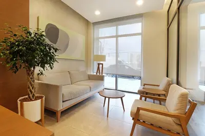 a living room with a couch and a table at Belgrade Waterfront Apartments - Arcadia in Belgrade