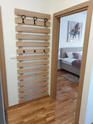 a room with a wooden wall with a closet at Apartman Magija in Arandjelovac