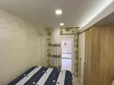 a bedroom with a bed and a window at Daca 1 in Belgrade