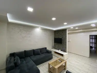 a living room with a couch and a tv at Daca 1 in Belgrade