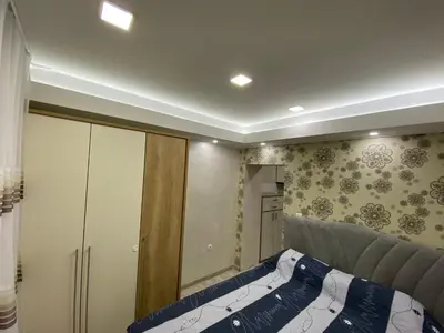 a room with a bed and a cabinet in it at Daca 1 in Belgrade