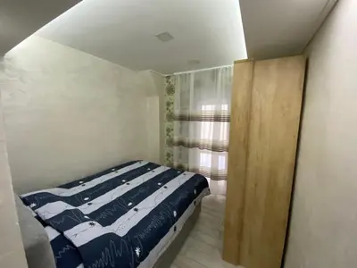 a small bedroom with a bed and a window at Daca 1 in Belgrade