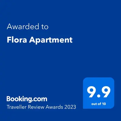 a blue screen with the text awarded to flora appointment at Flora Apartment in Surčin