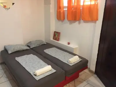 a bed in a room with two pillows on it at Stadion in Belgrade