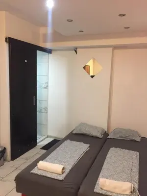 a bedroom with two beds and a origami at Stadion in Belgrade