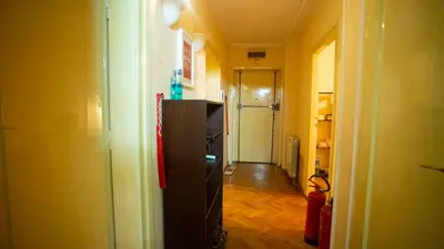 a hallway of a room with a refrigerator in it at Private cozy room 1 with shared kitchen in appartment, downtown Belgrade in Belgrade