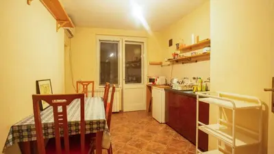 a kitchen with a table and a table and chairs at Private cozy room 1 with shared kitchen in appartment, downtown Belgrade in Belgrade