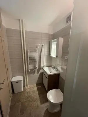 a small bathroom with a toilet and a sink at New Belgrade apartment in Belgrade