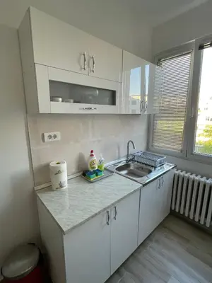 a kitchen with a sink and a counter top at Apartment 51 - Bright, spacious, lux 1 bedroom in the city center - Stari grad in Belgrade