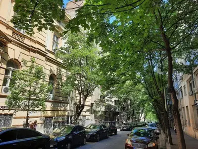 a street with cars parked on the side of the road at Apartment 51 - Bright, spacious, lux 1 bedroom in the city center - Stari grad in Belgrade