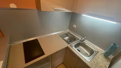 a small kitchen with a sink in the corner at Charlie&Blueberries 1 in Belgrade