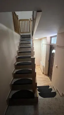 a staircase in a house with black carpeted stairs at Charlie&Blueberries 1 in Belgrade