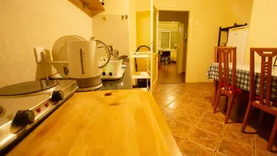 a kitchen with a stove and a counter top at Private cozy room 2 with shared kitchen in appartment in Belgrade