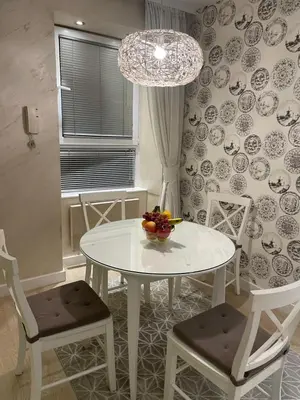 a white table and chairs with a bowl of fruit on it at Apartment Belgrade Nº3 in Belgrade