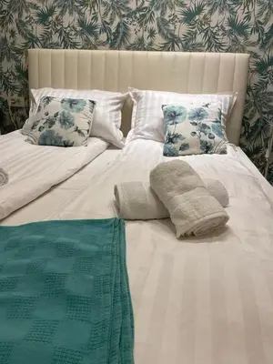 a bed with two pillows on top of it at Apartment Belgrade Nº3 in Belgrade