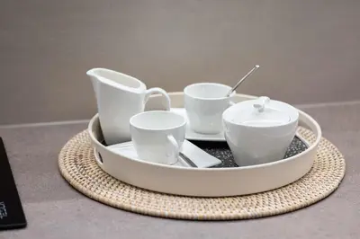 a tray with three cups and a spoon on a table at A Blok Top Living in Belgrade