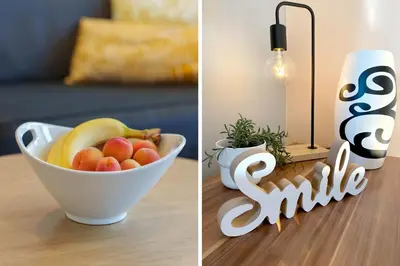 a bowl of fruit on a table next to a smile sign at Quince Apartment-City Center-Free parking in Belgrade