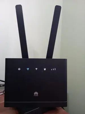 a black router with two antennas on top of it at Luna Apartment in Surčin