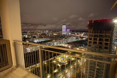 a view of a city at night from a balcony at Aurora 21 in Belgrade