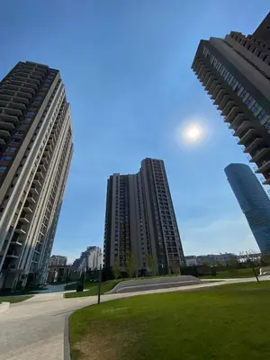 two tall buildings in a city with a park at Aurora 21 in Belgrade