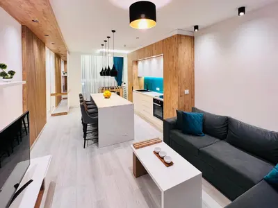 a living room with a couch and a table at Vivio 2 Luxury Apartment in Belgrade