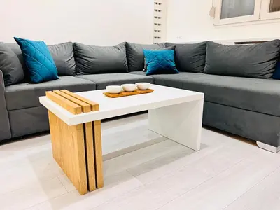 a living room with a couch and a white coffee table at Vivio 2 Luxury Apartment in Belgrade