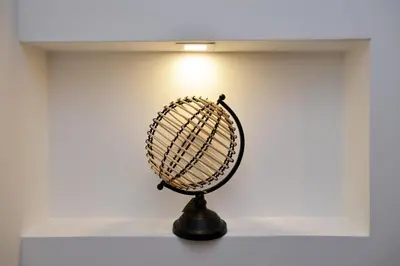a black fan sitting on a shelf in a room at River&Bike Apartment in Belgrade