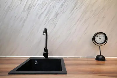 a clock and a scale on a wooden floor at River&Bike Apartment in Belgrade