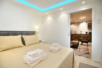 a bedroom with a bed with towels on it at River&Bike Apartment in Belgrade