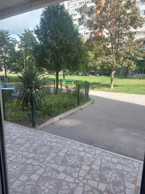 a view of a park with a fence and trees at River&Bike Apartment in Belgrade