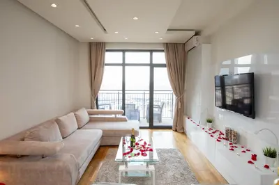 a living room with a couch and a tv at Belgrade Waterfront Apartments - River View in Belgrade