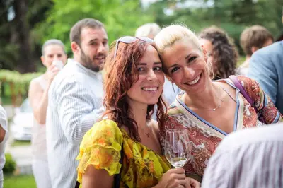 two women standing next to each other holding a wine glass at Villa Luxury Rooms - Wine Resort in Smederevo