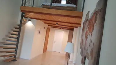 a hallway with a staircase in a house at Villa Luxury Rooms - Wine Resort in Smederevo