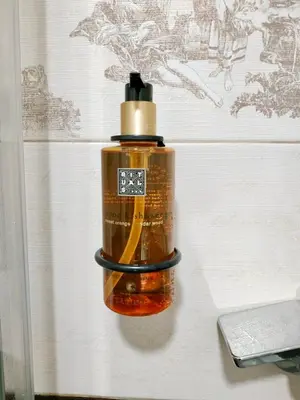 a plastic bottle is hanging on a wall at Paradise Museum City Center in Belgrade