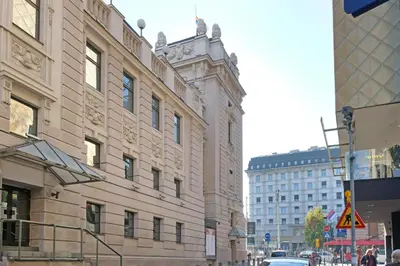 a building with a clock tower on top of it at Paradise Museum City Center in Belgrade