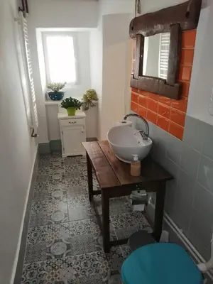a bathroom with a sink and a mirror at Matejev konak in Šušara