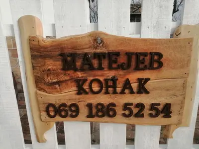a sign in front of a white fence at Matejev konak in Šušara