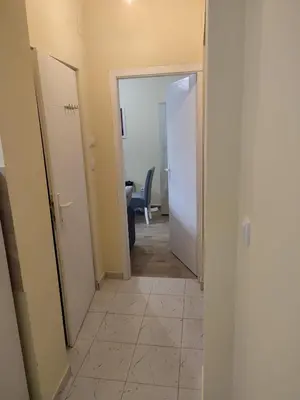 a hallway with a hallway leading to a room at Orion Apatman in Belgrade