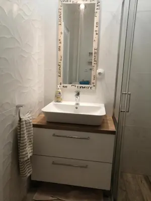 a bathroom with a sink and a mirror at Green 1 in Belgrade