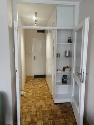 a hallway with a door open to a bathroom at Green 1 in Belgrade