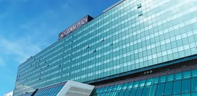 a building with a sign on top of it at Crowne Plaza Belgrade by IHG in Belgrade