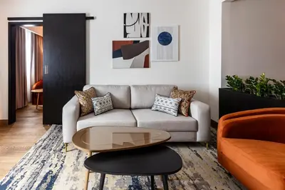 a living room with a couch and a table at Crowne Plaza Belgrade by IHG in Belgrade