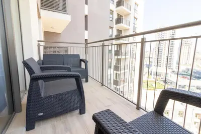 a balcony with chairs and a view of a city at Belgrade Waterfront Studio Apartment-Supertwins in Sajmište