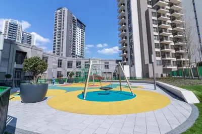 a playground in the middle of a city with tall buildings at Belgrade Waterfront Studio Apartment-Supertwins in Sajmište