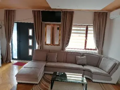 a living room with a couch and a table at Pelegrino in Stara Pazova
