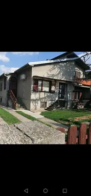 a house with a building with windows and a porch at Pelegrino in Stara Pazova