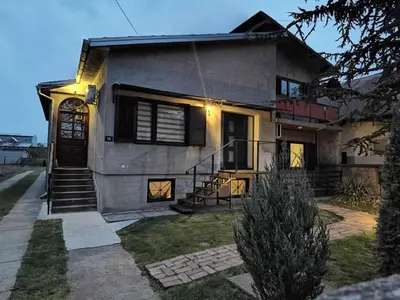 a house with a staircase in front of it at Pelegrino in Stara Pazova